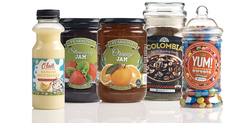 Variety of glass jars with coloured labels that are food packaging compliant